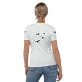Close-up of the Eerie Elegance Women's Crewneck Tee's spooky print